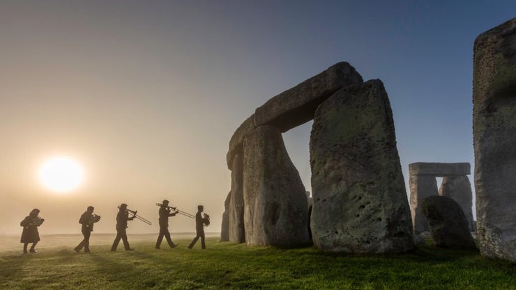 Band celebrating at Stonehenge